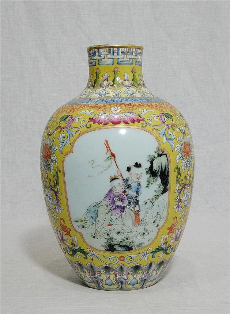 Chinese Famille Rose Porcelain Vase With Mark: Chinese famille rose porcelain vase, decorated with open window of kids playing around by flowers. Four blue Chinese character mark on the base. Good condition. 10.25" height.