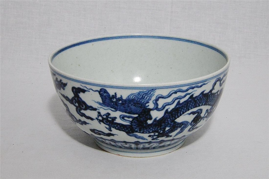 Chinese Blue and White Porcelain Bowl With Mark: Chinese blue and white porcelain bowl, decorated with dragons. Six blue Chinese character under glaze mark on the base. Good condition. 7" diam x 3" height.