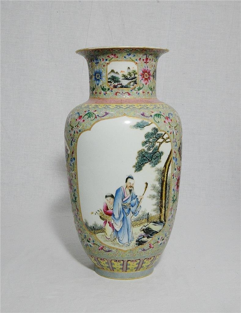 Chinese Famille Rose Porcelain Vase With Mark: Chinese famille rose porcelain vase, decorated with open window of figures around by flowers. Six red Chinese character mark on the base. Good condition. 12.25" height.