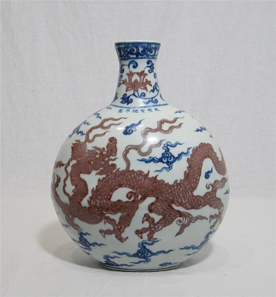 Chinese Blue and White Porcelain Vase With Mark: Chinese blue and white porcelain vase, decorated with iron red dragons. Six blue Chinese character under glaze mark on the shoulder. Good condition. 12" height.