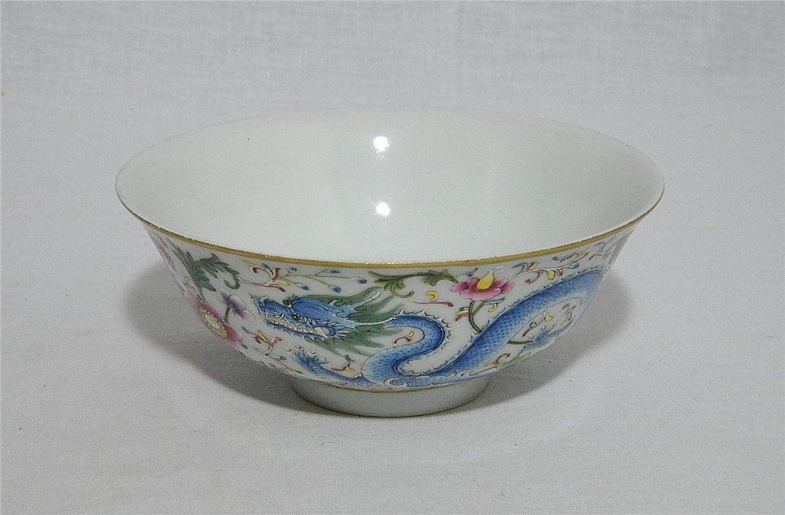 Chinese Famille Rose Porcelain Bowl With Mark: Chinese famille rose porcelain bowl. decorated with different color of dragons and flowers. Six red Chinese character mark on the base. Good condition. 5.75" diam x 2.75" height.