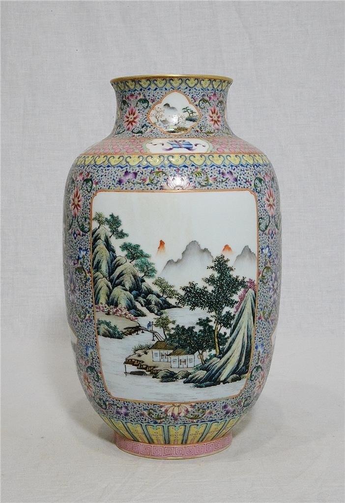 Chinese Famille Rose Porcelain Vase With Mark: Chinese famille rose porcelain vase, decorated with open window of landscape and mountain view around by flowers. Four red Chinese character mark on the base. Good condition. 12" height.
