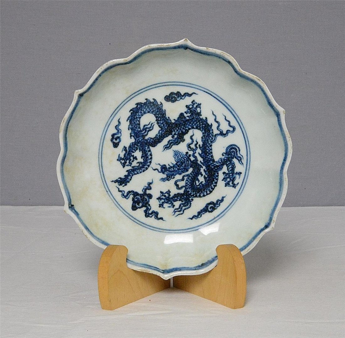Chinese Blue and White Porcelain Plate With Mark: Chinese blue and white porcelain plate, decorated with dragon and flowers. Six blue Chinese character under glaze mark on the base. Good condition. 7.75" diam.