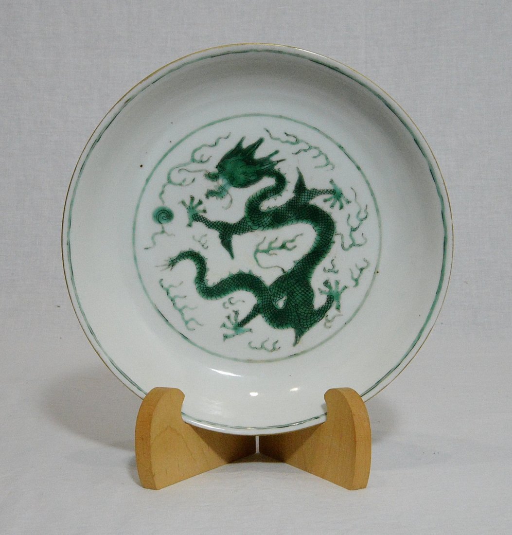 Chinese Famille Rose Porcelain Plate With Mark: Chinese famille rose porcelain plate, decorated with dragons . Six red Chinese character mark on the base. Good condition. 8.1" diam.