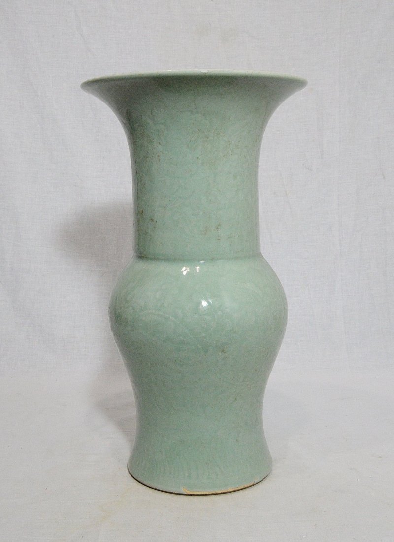 Chinese Monochrome Green Glaze Porcelain Beaker Vase: Chinese monochrome green glaze porcelain vase, decorated with flowers. Good condition. 16" height.