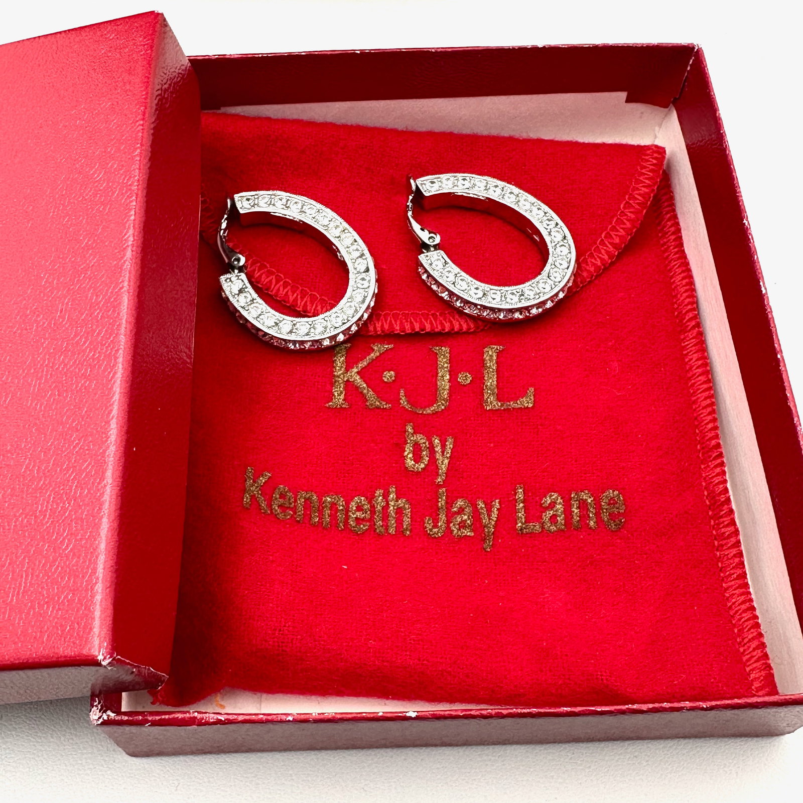 Vintage KJL Kenneth Jay Lane Clear Crystal Silver Tone Elongated Hoop Clip Earrings 1.25 Inch (1 of 2)