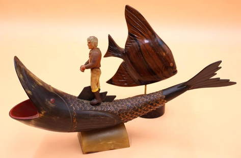 Vintage Hand Carved Buffalo Horn and Wooden Fish Decor: Vintage Folk art carved horn of a fish with a vintage Fisher Price outdoorsman glued a top. This lot also features a carved wooden Angel fish figure for decor.