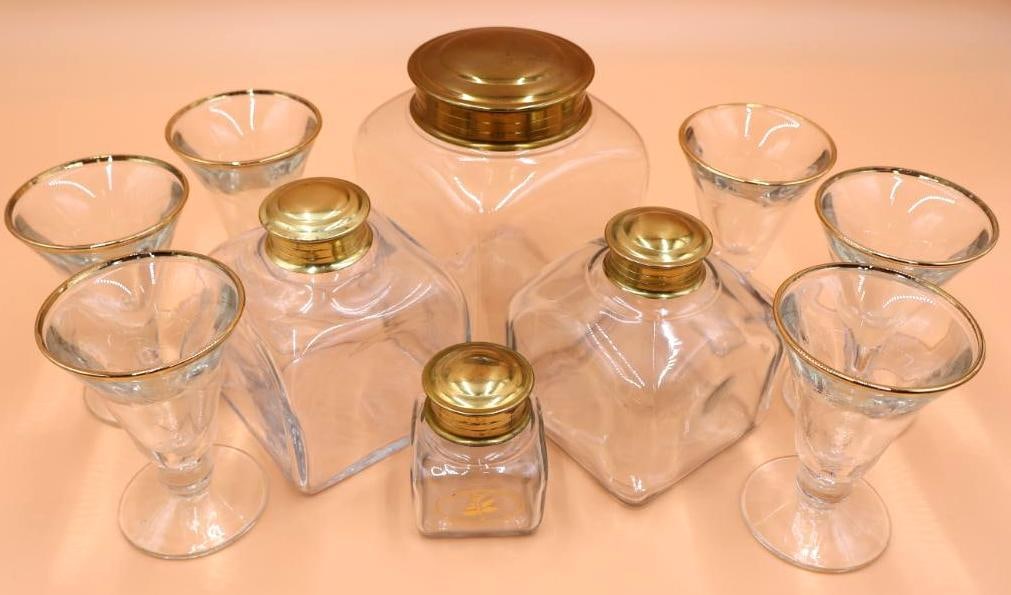 Apothecary Style Danish Canisters and Gold Rimmed Glasses: Thick clear glass cocktail or sundae glasses and glass canisters with gold colored metal lids.