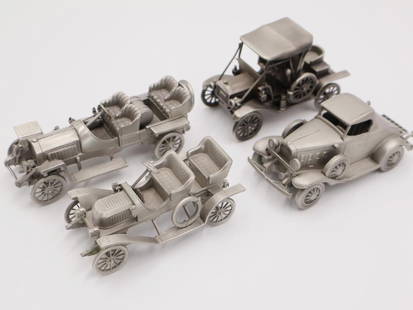 Collection of Four Danbury Mint Pewter Model Cars: Detailed and well made pewter model cars by Danbury Mint. Includes 1909 Stanley Steamer, 1907 Thomas Flyer, 1932 Chevrolet Sport Roadster, and 1909 Ford Model T
