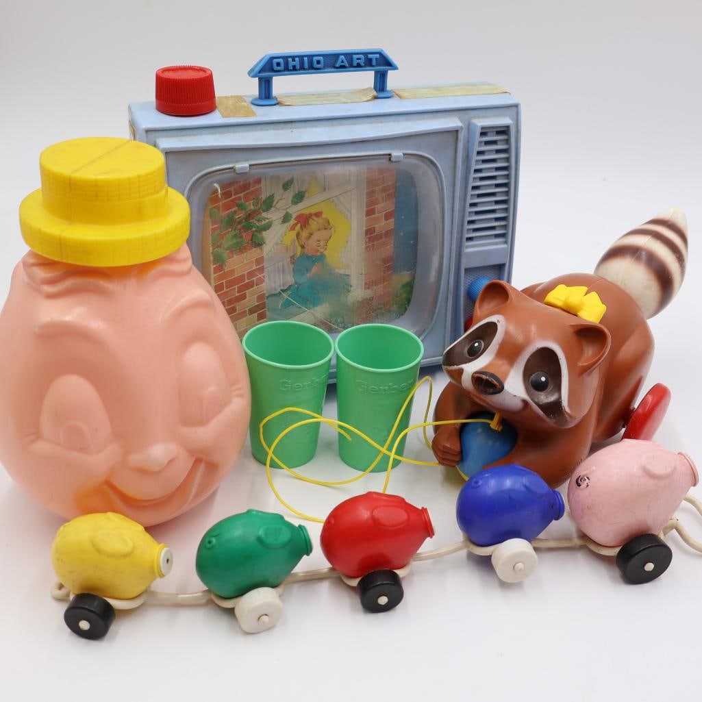Vintage Children's Toys: Fisher price 'This Little Pig Went To Market', Gerber two sided rocking toy, Fisher Price Racoon pull along, and Ohio Art musical TV. Please see all photos for conditions