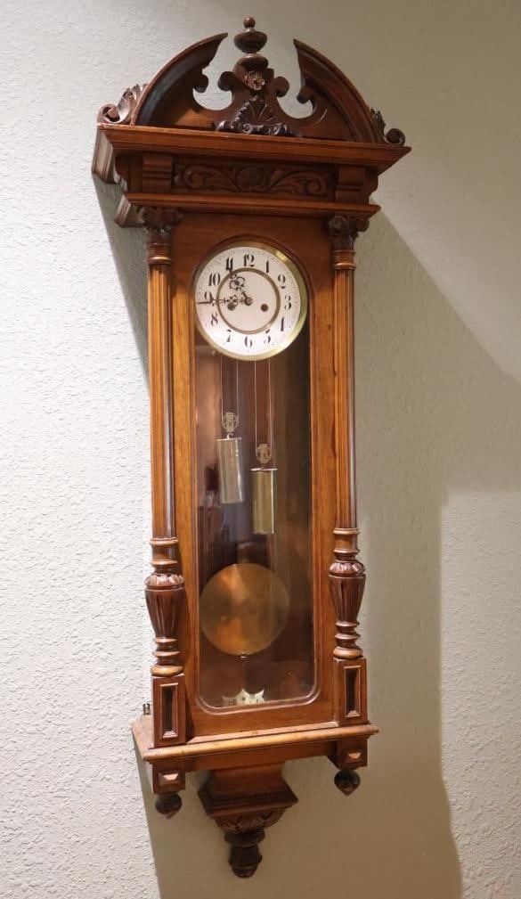 Antique 1840's Hungary Dual Weight Wall Clock: Includes winding key and original black and white photo of the clock with information. Porcelain clock face appears to have a letters 'Brau..' with more undiscernible. Face has cracks please see all p