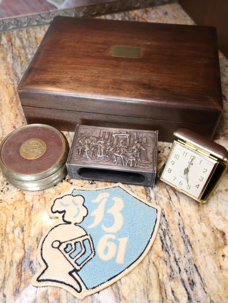Vintage Mahogany Humidor, Match Box Holder, Patch, Coasters, and Clock: Vintage humidor wood box lined in milk glass, wool type school patch with 'B 61', Elgin travel clock, silverplate match box holder, and three brass and leather coasters with hat tipping emblem