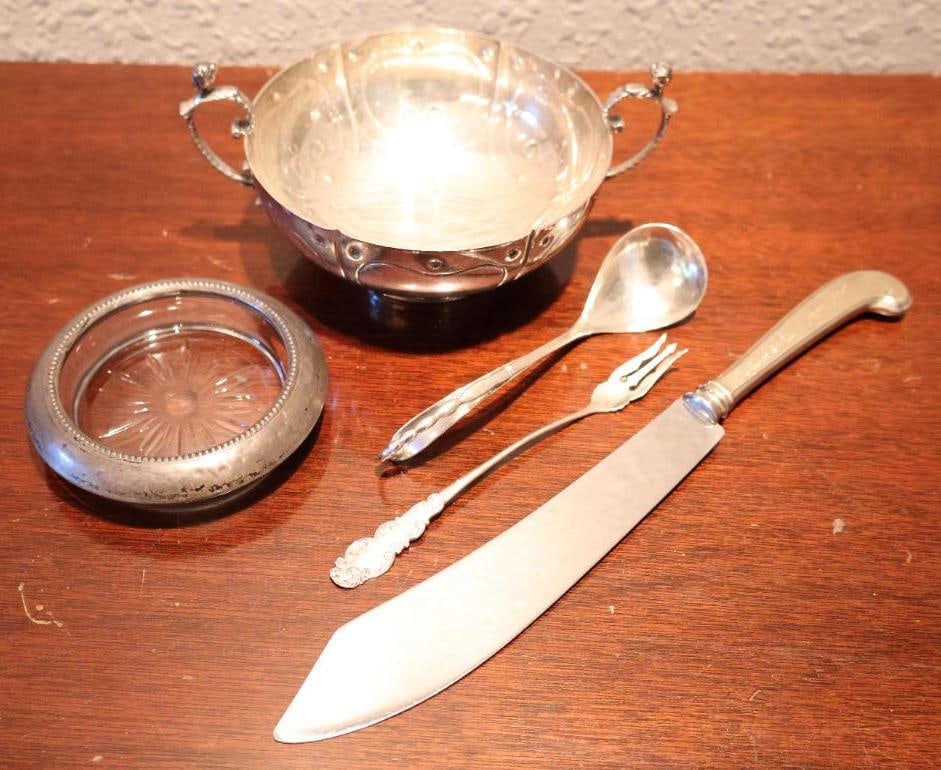 Various Sterling Silver Pieces including Cartier Sterling Dish: Webster Sterling Handle cake cutter, sterling marked fork, sterling ornate spoon, Frank M. Whiting & co. Sterling rimmed coaster, and marked 'Cartier Simeon Soumain Reproduction circa 1720 Sterling 50
