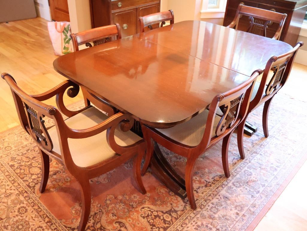 Vintage Duncan Phyfe Lyre Table with Six Matching Lyre Backed Chairs: Most likely from the 1930s/40s, beautiful table with 4 leaves total. Table top has some wear and scuffs but overall great condition for age, please see all photos. Very sturdy with leaves since the fo