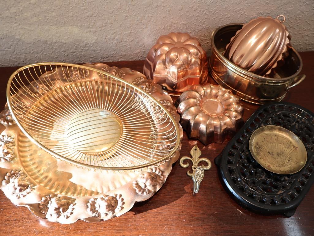 Collection of Metal Decor Items: Copper models, cast iron trivet, brass shell coaster, Fleur de Lis wall hook, brass wire basket, ornate plate