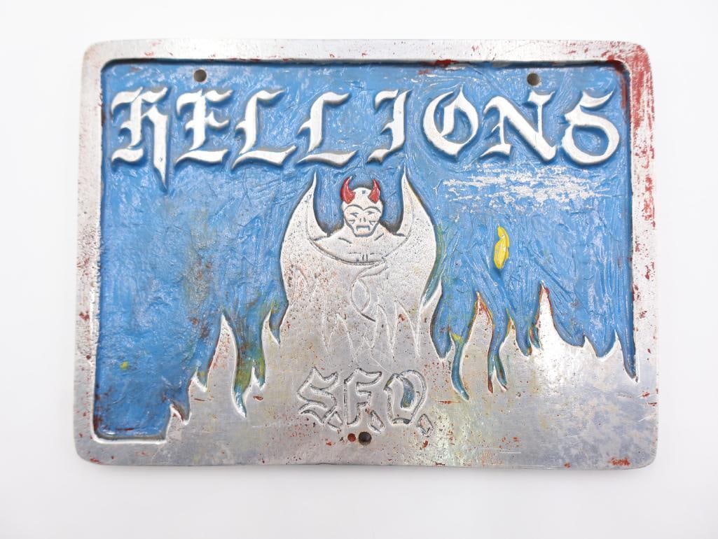 Vintage, hand-painted metal plaque associated with the Hellions motorcycle club: The design includes a winged demon figure and flame motifs. View all photos for details and sizing. By placing a bid, you acknowledge that you have examined the item to your satisfaction and accept it