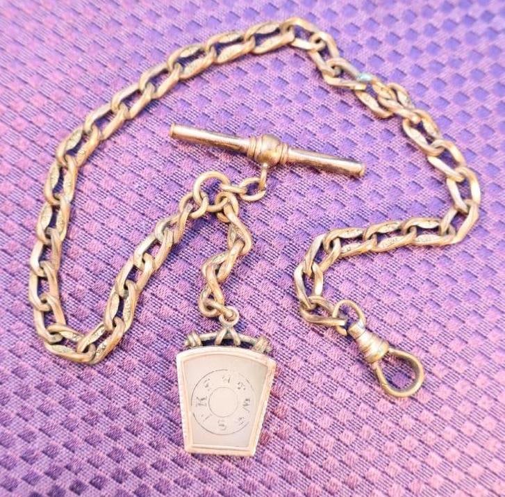 Antique Victorian-era Agate Masonic watch fob with a chain and T-bar: The fob features Masonic symbols, including the letters "HTWSSTKS" arranged in a circle, which stands for "Hiram, Tyrian, Widow's Son, Sendeth to King Solomon". Click on the main photo to view additio