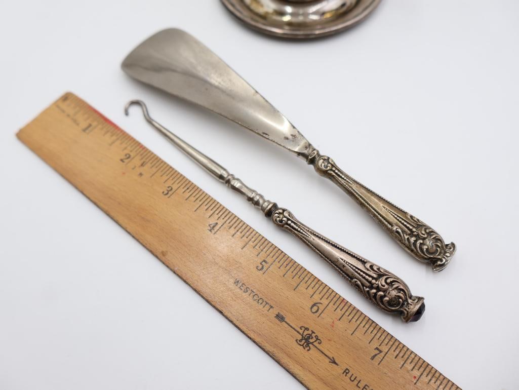 Antique Sterling Silver items includes a small cup with a saucer, a button hook, and a shoehorn - 3