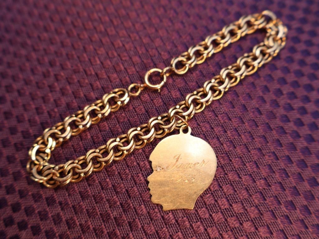 1958, 14k Charm bracelet with a silhouette head charm (1 of 7)