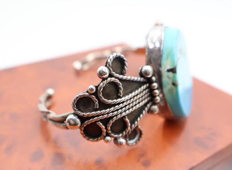 Vintage sterling silver cuff bracelet with a large, oval turquoise-colored stone - 4