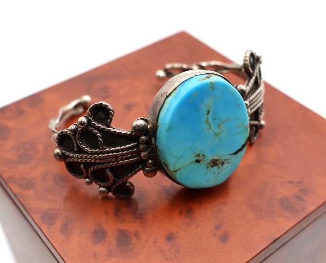 Vintage sterling silver cuff bracelet with a large, oval turquoise-colored stone - 5