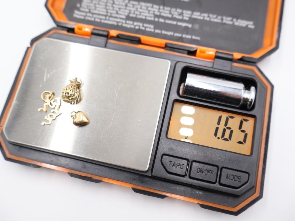 Collection of various gold jewelry charms - 8