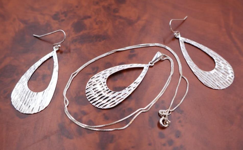 Sterling Silver textured teardrop dangle earrings and a matching necklace pendant (1 of 9)
