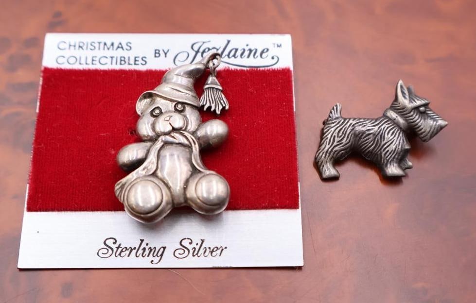 Sterling silver Bear and Scotty Dog Brooches: One of which is a Scottish Terrier (Scottie dog) design. The items are explicitly labeled as "Christmas Collectibles" and "Sterling Silver". 