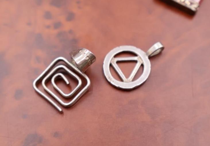 A red jade pendant and two sterling pendants - 4