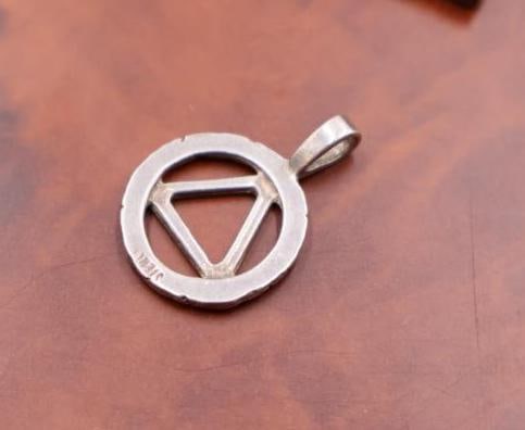 A red jade pendant and two sterling pendants - 5