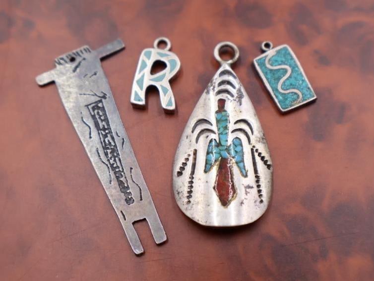 Vintage Navajo style sterling silver pendants: Featuring turquoise and coral chip inlay. Click on the main photo to view more photos of this lot. 