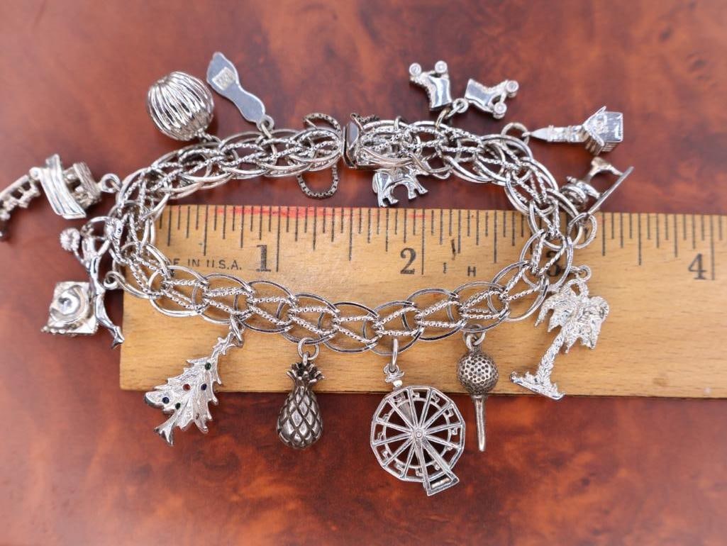 Vintage sterling silver charm bracelet with various charms - 2