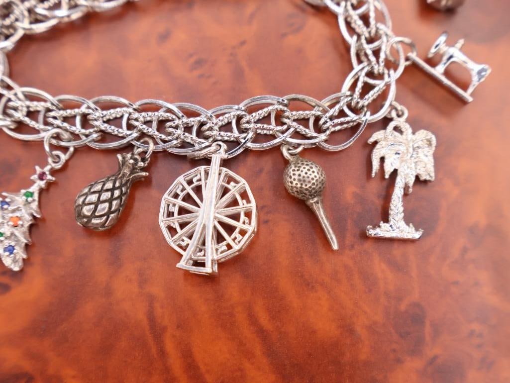Vintage sterling silver charm bracelet with various charms - 4