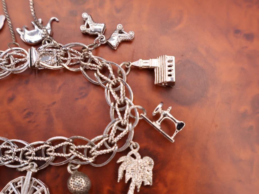 Vintage sterling silver charm bracelet with various charms - 5