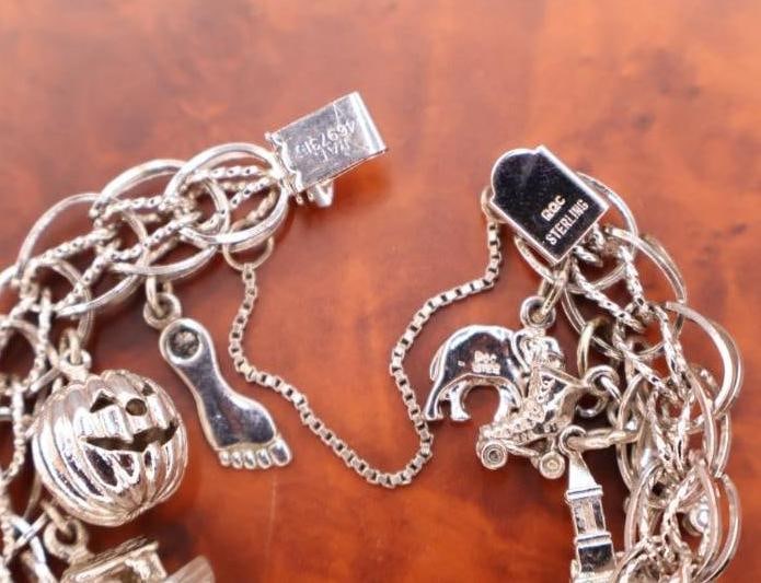 Vintage sterling silver charm bracelet with various charms - 8