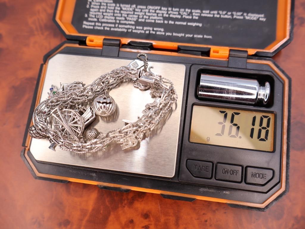 Vintage sterling silver charm bracelet with various charms - 9