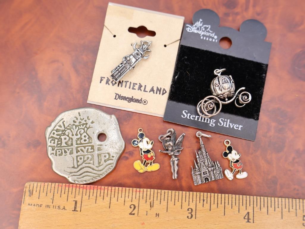 Collection of Disney-themed charms and Vintage Pirates Medallion - 2
