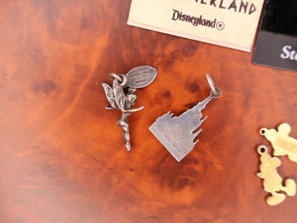 Collection of Disney-themed charms and Vintage Pirates Medallion - 7