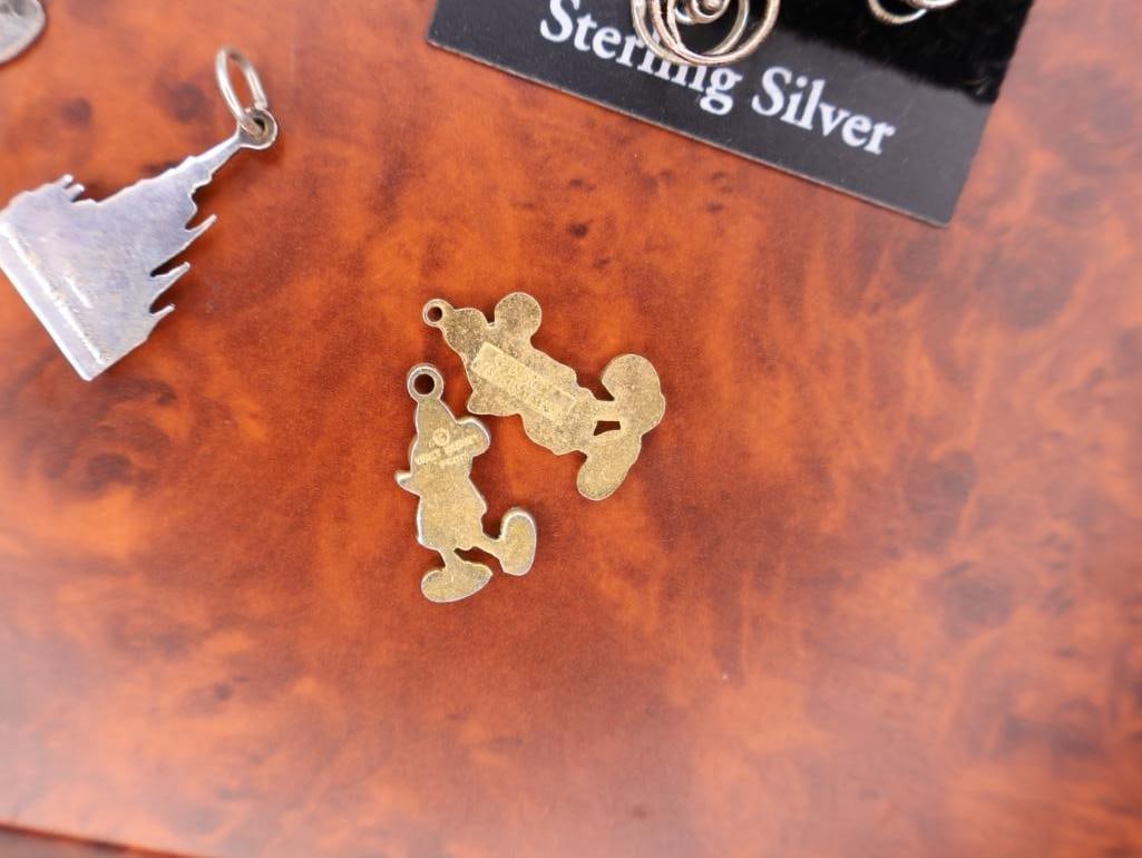 Collection of Disney-themed charms and Vintage Pirates Medallion - 9