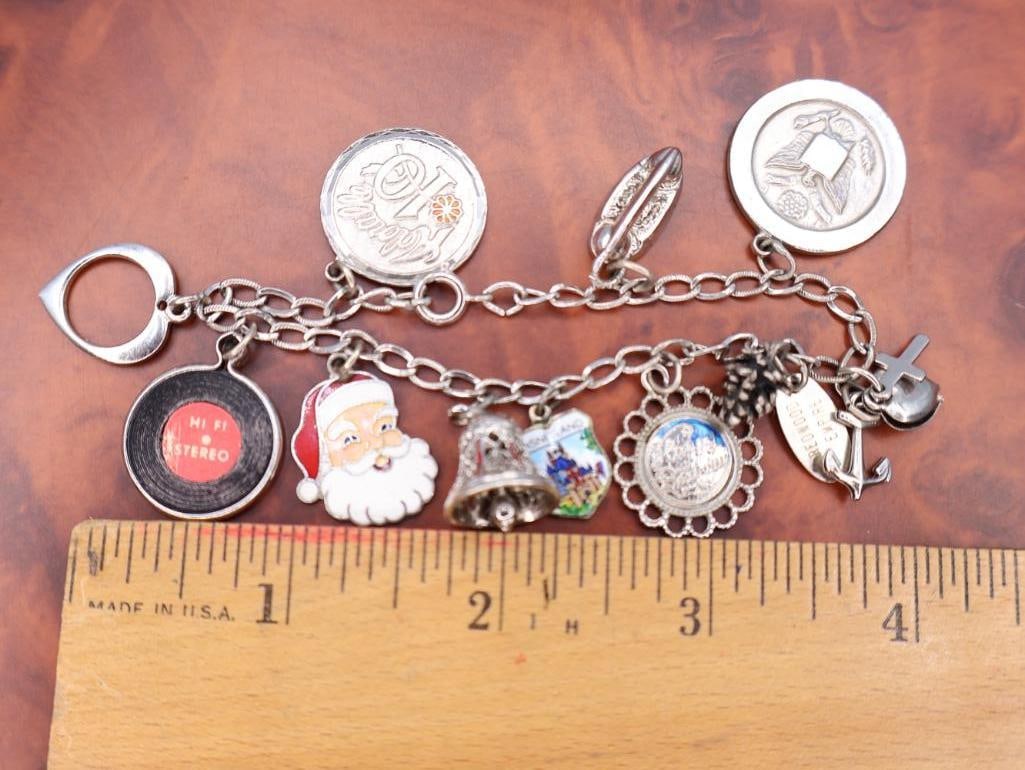 Vintage sterling silver charm bracelet with assorted collectible charms - 2