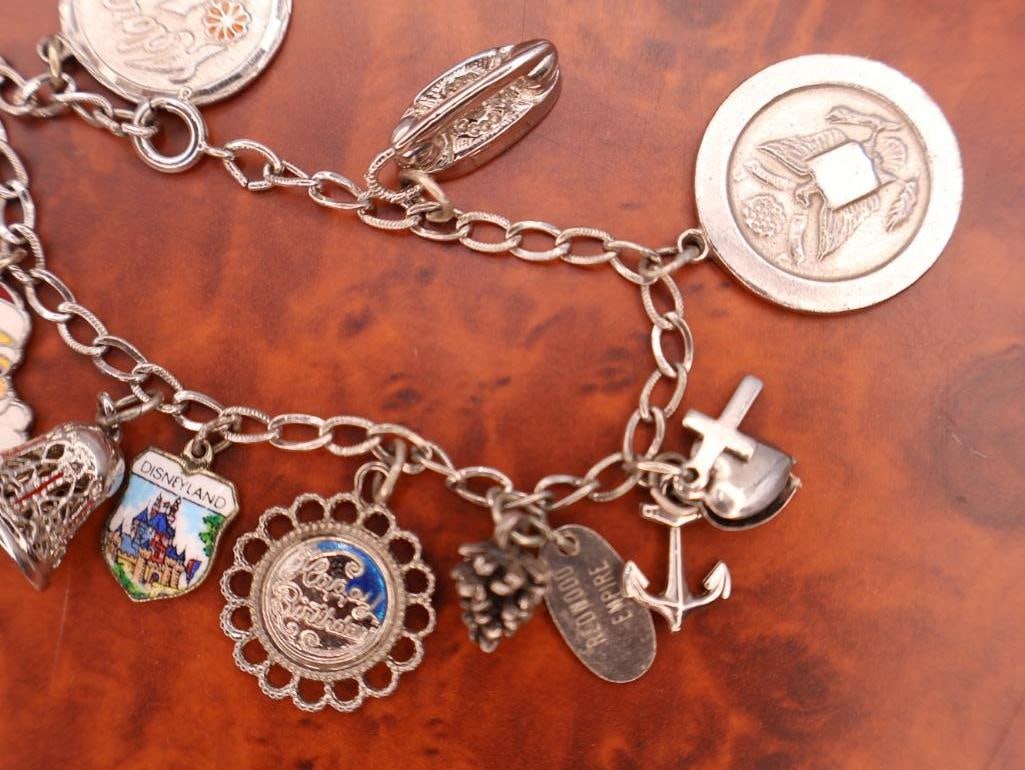 Vintage sterling silver charm bracelet with assorted collectible charms - 3