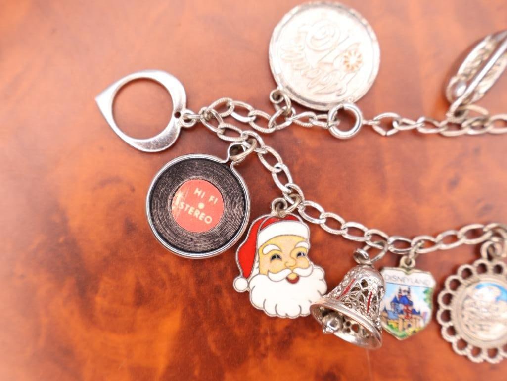 Vintage sterling silver charm bracelet with assorted collectible charms - 5