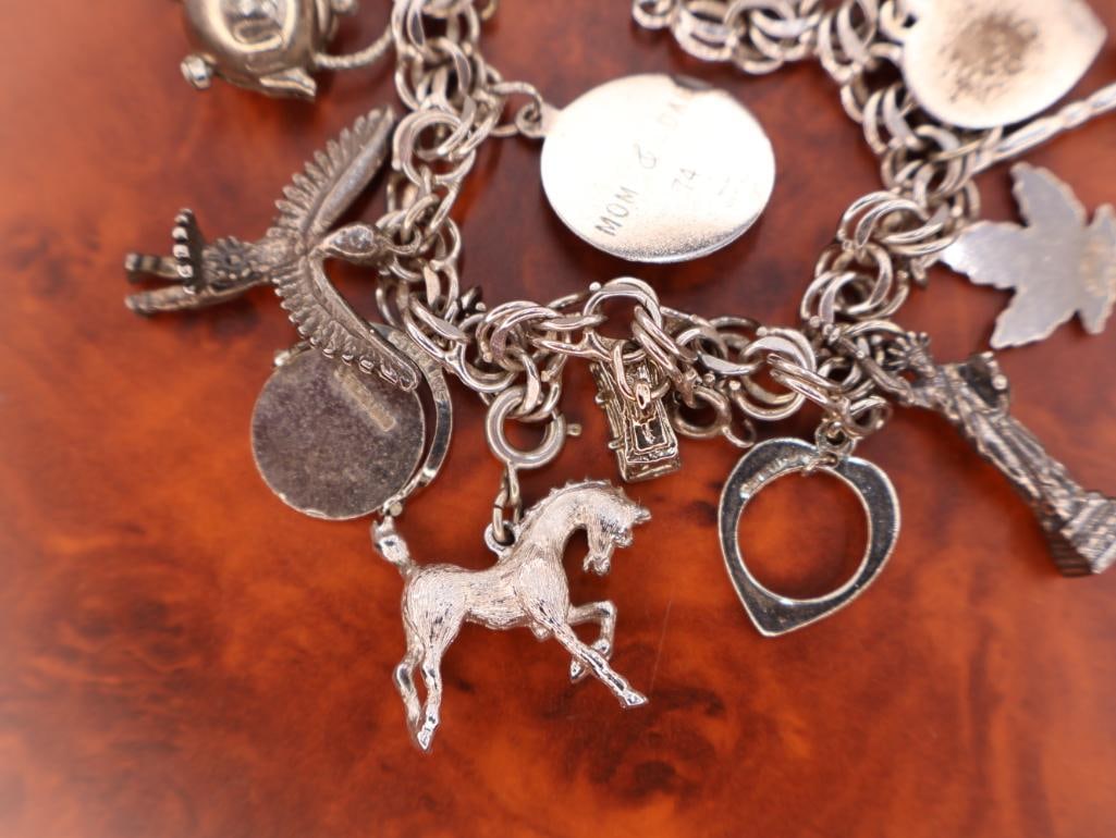 Vintage sterling silver charm bracelet with assorted charms - 6