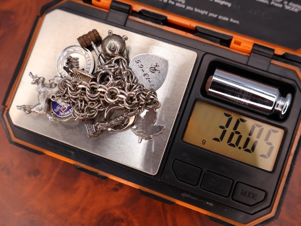 Vintage sterling silver charm bracelet with assorted charms - 9