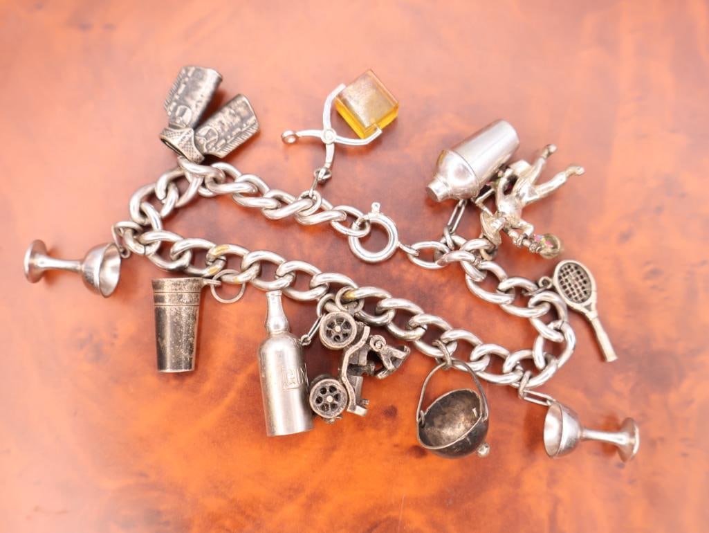 Vintage sterling silver charm bracelet with various novelty and cocktail-themed charms.: Charms include items like a cocktail shaker, a highball glass, a stemmed cocktail glass, a bottle, a tennis racket, and a covered wagon. 
