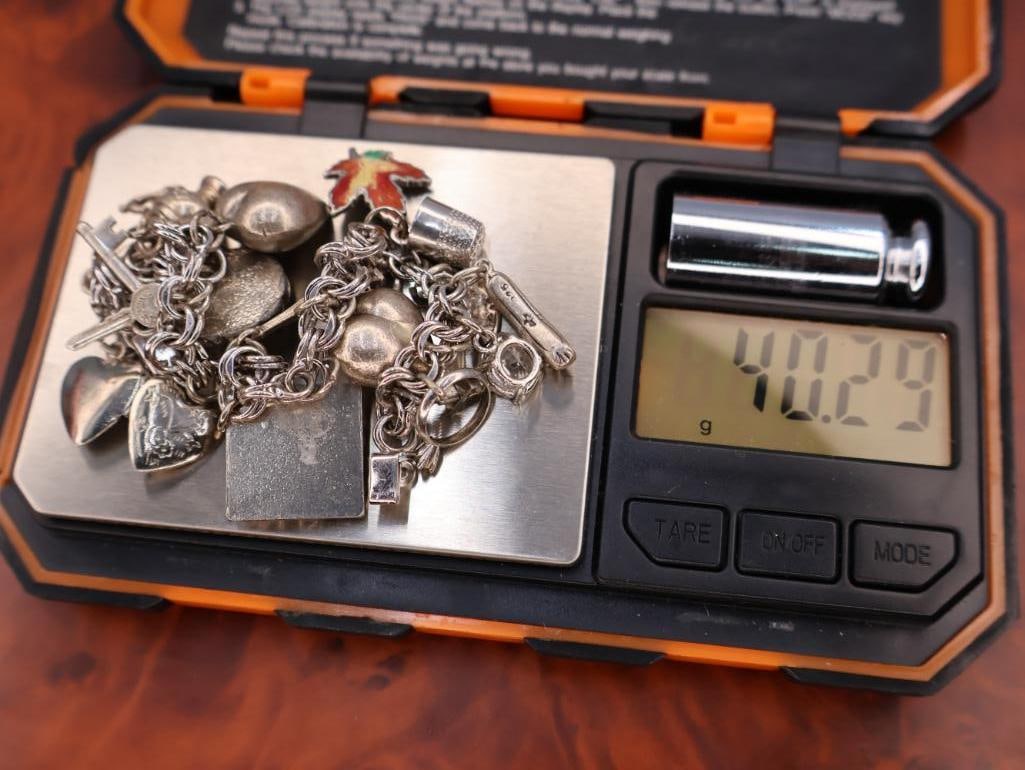 Vintage sterling silver charm bracelet with assorted charms - 11