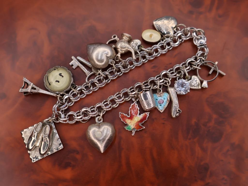 Vintage sterling silver charm bracelet with assorted charms (1 of 11)