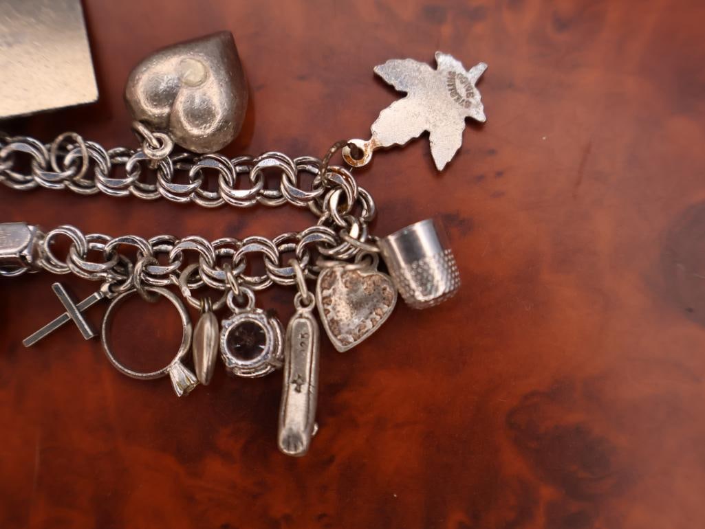 Vintage sterling silver charm bracelet with assorted charms - 7