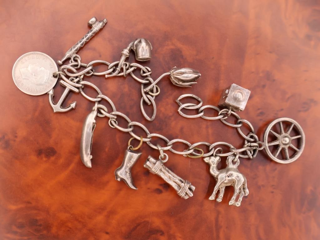 Vintage silver charm bracelet with assorted charms (1 of 8)