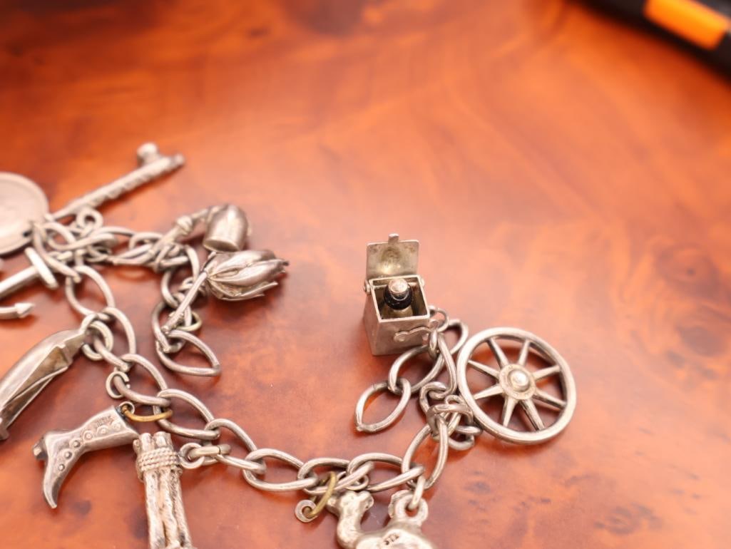 Vintage silver charm bracelet with assorted charms - 4